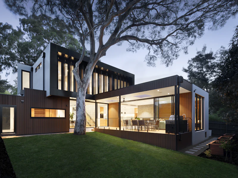 Completed contemporary residential home lit at dusk