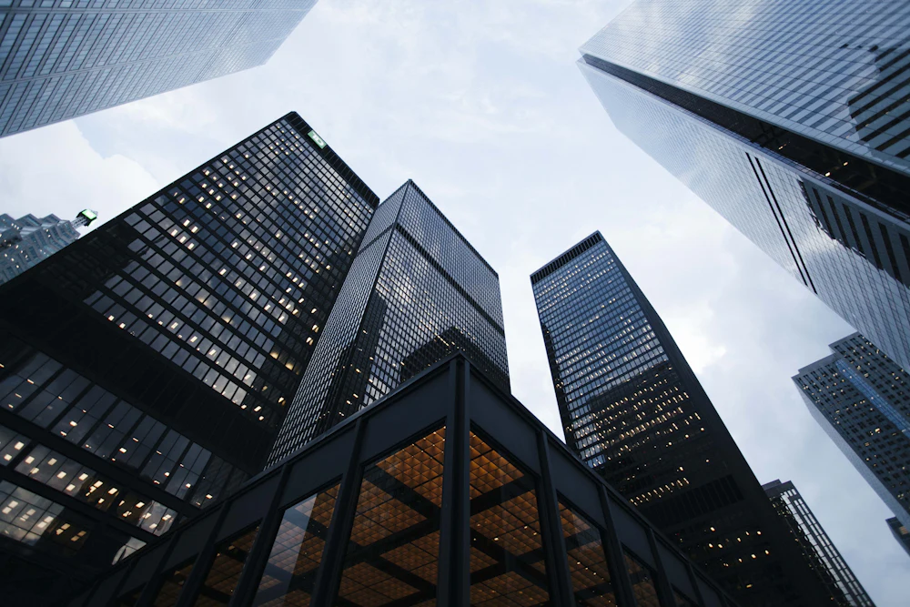Glass and steel commercial towers viewed from street level